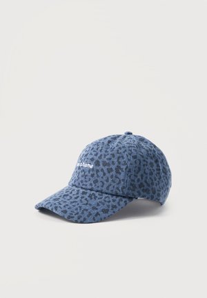 Blue baseball cap with dark leopard print and white embroidered text "No shame" on front, displayed on a light neutral background.