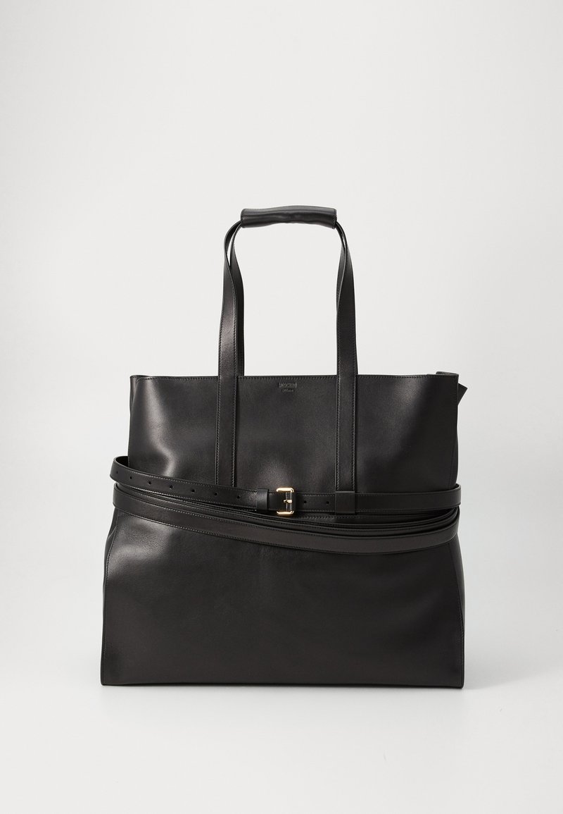 Black leather tote bag with structured shape, flat handles, and a contrasting belt detail with a gold buckle accent. Smooth texture.