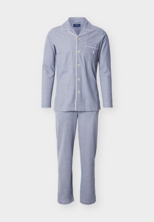 Light blue cotton pajama set with long sleeves and pants, featuring white piping along the collar and pocket, and buttons down the front.