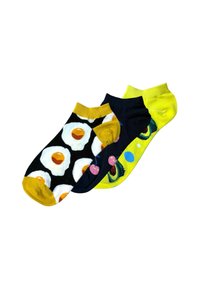Drei Paare Knöchelsocken: eines mit schwarzem Hintergrund und Spiegeleiern, eines mit bunten Mustern auf dunklem Grund und eine leuchtend gelbe Socke.