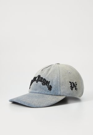 Denim baseball cap, light blue with black embroidered text "Palm Angels" on the front and logo on the side. Curved brim, structured design.