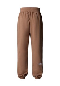 Bruna sweatpants i mjukt material, med elastiskt midjeband och muddar, samt en vit logotyp på vänster lår.