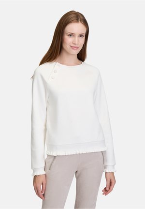 Weißes Sweatshirt mit rundem Ausschnitt, drei dekorativen Knöpfen an der Schulter und einem Rüschensaum. Weiches Material mit lockerer Passform.