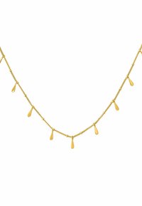 Collar de cadena dorada con colgantes en forma de lágrima, que presenta un diseño delicado y una textura suave. La luz se refleja en la superficie pulida.