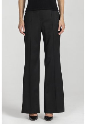 - Spodnie materiałowe