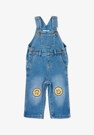 Salopette per bambini in denim blu con spalline regolabili, tasca sul davanti e due toppa gialle a forma di faccina sorridente sulle ginocchia.