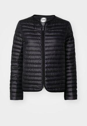 Black puffer jacket with a zip front, rounded collar, quilted texture, and long sleeves. Features subtle branding on the label.
