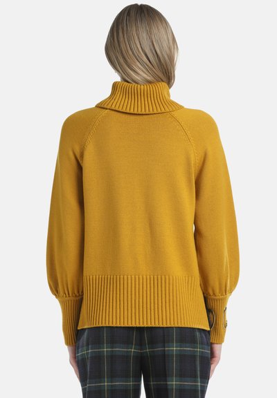 Mustard yellow pullover sweater with a high ribbed collar, raglan sleeves, and ribbed hem. Features button accents on the sleeves.