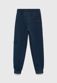 Mörkblå joggingsbyxor i mjukt tyg, med elastisk midja, avsmalnande ben och en ficka med dragkedja på låret.