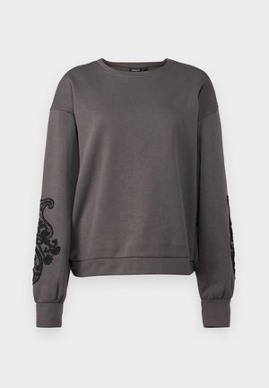 Gray sweatshirt with long sleeves, featuring black embroidered designs on the sleeves and a relaxed fit. Soft fabric and ribbed cuffs.