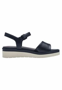 Sandale en cuir bleu marine avec un design à bout ouvert, une sangle de cheville réglable et une épaisse semelle en crêpe crème. Texture lisse et style minimaliste.