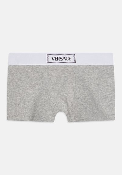 Gray cotton boxer shorts with a white elastic waistband featuring a black rectangular label that reads "VERSACE."
