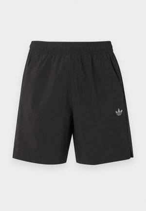 Schwarze elastische Sportshorts mit seitlichen Taschen und kleinem Adidas-Logo am linken Bein.