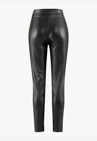 Black faux leather leggings with a smooth texture, featuring a high waist, slim fit, and two discreet front pockets.
