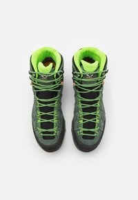Green and black hiking boots with textured suede upper, vibrant green laces, and padded collar for support. Rubber outsole for traction.