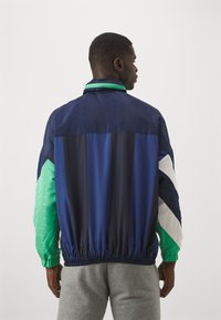 Umbro PANELLED TRACK JACKET - Tréningová bunda - dark navy/peppermint