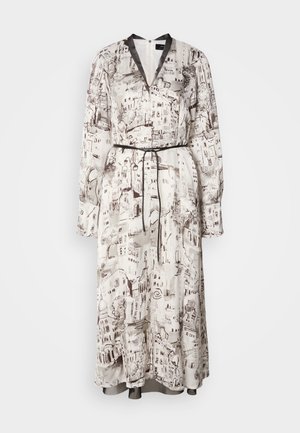 Long sleeved maxi dress in cream fabric with brown artistic cityscape prints. Features a deep V-neck, black waist tie, and cuffed sleeves.
