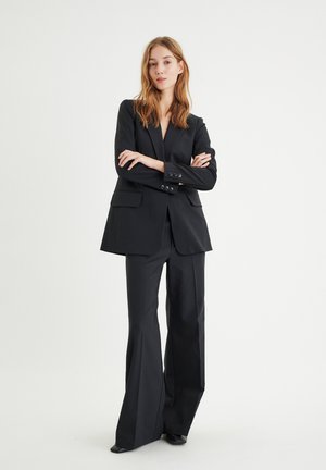 ZELLAIW WIDE - Pantaloni - black