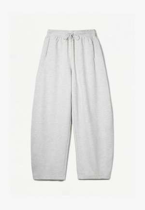 Hellgraue Sweatpants mit entspannter Passform, elastischem Bund, Kordelzug und seitlichen Taschen; aus weichem, strukturiertem Stoff gefertigt.