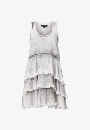 Tiered, sleeveless dress in gray with black accents. Made from a soft fabric, features frayed edges and layered ruffles for texture.
