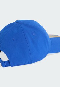 Plava bejzbol kapa od pamuka s zakrivljenim vizirjem, podesivim trakama i suptilnim detaljima šivanja na površini tkanine.