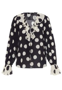 Blusa a pois bianca e nera con colletto arricciato, scollo a fiocco e maniche svasate. Realizzata in tessuto leggero con una morbida texture.