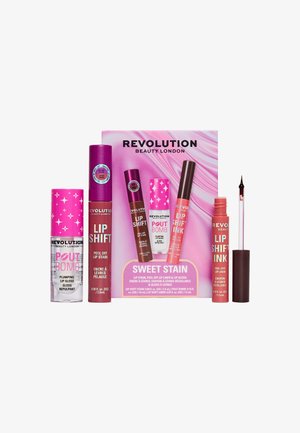 Le set Revolution Beauty London Sweet Stain comprend un stain à lèvres peel-off, un crayon à lèvres et un gloss repulpant avec des teintes rose et marron.