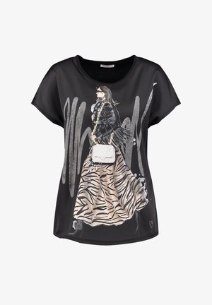 Black short-sleeve top featuring a graphic print of a stylish figure in a zebra-print skirt, with a chain-strap handbag and metallic accents.