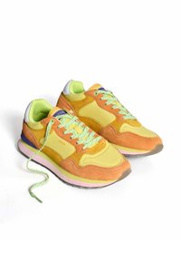 Multicolored sneakers featuring a combination of suede and mesh in orange, yellow, and green. Thick rubber sole with pastel accents.