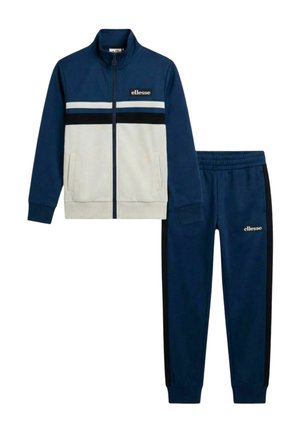 Veste zippée marine et blanche avec poches avant et joggings assortis marine avec bandes latérales noires et logos ellesse sur les deux pièces.