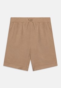 Shorts beiges en tissu doux avec une taille élastique et un cordon de serrage, dotés de poches latérales et d'un design de jambe droite.