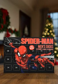 Spider-Man themed advent calendar, featuring a black background, red accents, and illustrations of Spider-Man. Contains 12 pairs of men's socks.