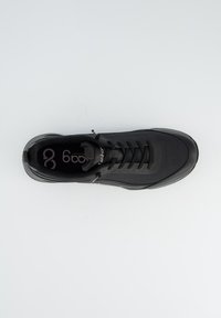 Black athletic shoe featuring a sleek design, smooth synthetic upper, and textured laces, with a cushioned sole and logo on the insole.