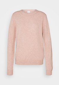 Ljusrosa stickad tröja med rund halsringning, långa ärmar, ribbade muddar och en lös passform, tillverkad av mjukt texturerat tyg.