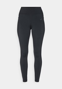 Leggings neri con vita alta, design elegante, tessuto elastico e tasche laterali. Presentano un discreto logo del marchio sulla coscia superiore.