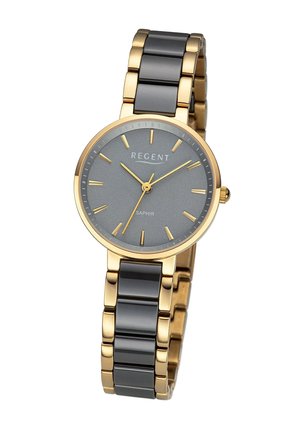 Montre en métal doré avec un cadran gris, dotée d'index horaires et d'un affichage de la date. Le bracelet associe des maillons dorés et noirs pour un contraste.