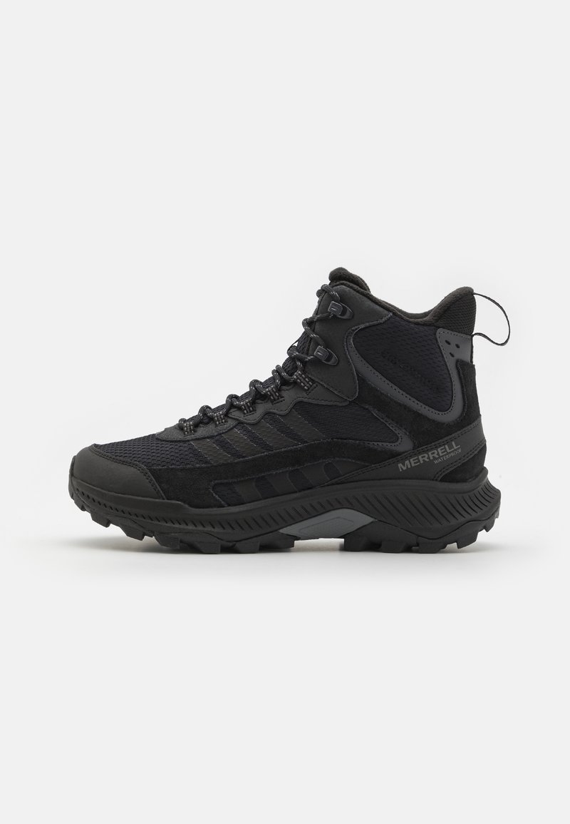 Black hiking boot featuring a combination of suede and mesh materials, textured grip sole, and a padded collar for support.