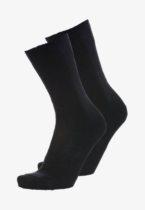 Schwarze Baumwollsocken mit glatter Textur, in Knöchelhöhe und verstärktem Zehenbereich. Klassisches Design, geeignet für den täglichen Gebrauch.