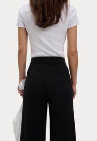 Marks & Spencer Kalhoty - black