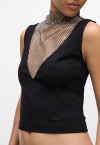 Black sleeveless top with a deep V-neck and a sheer mesh collar. Features a subtle logo on the hem and a fitted design.
