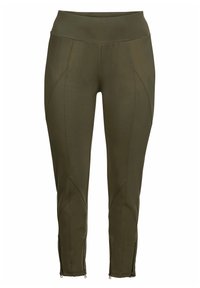 Pantaloni sportivi verde oliva con vita alta, caratterizzati da cuciture decorative e zip alle caviglie. Realizzati in un materiale elastico e liscio.