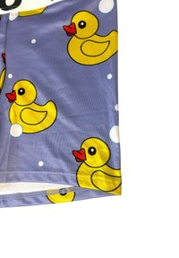 Purple fabric with printed yellow rubber ducks and white bubbles scattered across the surface.