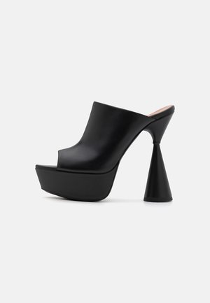 Black open-toe platform heeled sandal with a smooth finish, angular shape, and a unique conical heel design. Solid color, no patterns.