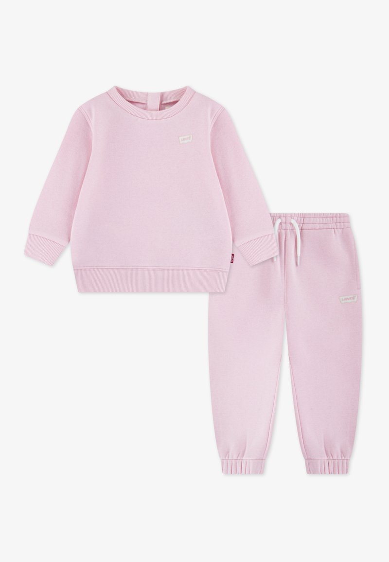 Rosa Sweatshirt- und Jogginghose-Set für Kleinkinder aus weichem Stoff. Das Sweatshirt hat einen Rundhalsausschnitt und gerippte Bündchen; die Hose ist mit einem elastischen Bund ausgestattet.