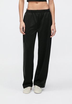 ARCHIVE TRACK PANT - Verryttelyhousut - black