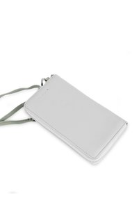 Light gray leather wallet with a zip closure and green strap. Features a smooth texture and minimalistic design.