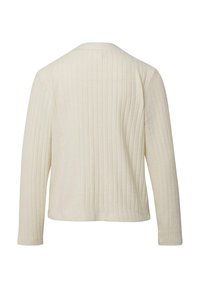 Langärmeliges Oberteil in Cremefarbe mit vertikal gerippter Textur, rundem Ausschnitt und lockerer Passform. Keine sichtbaren Verschlüsse oder Verzierungen.