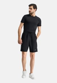 Formbelt 2-IN-1 - Jogginghose - schwarz