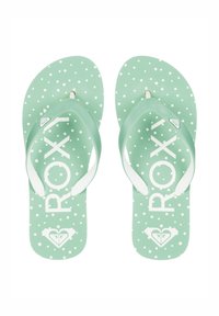 Gröna flip-flops med vita prickar och en stor "ROXY"-logotyp. Mjukt material, strukturerat fotsäng och vita gummiband.