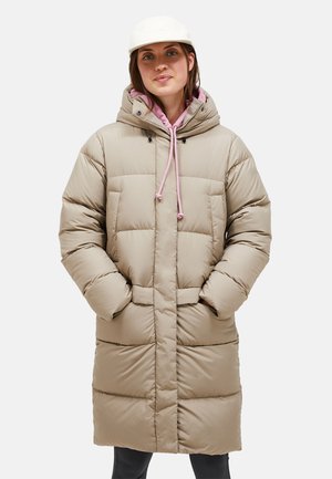 Beige puffer coat with a hood, pink drawstring, and front pockets. Features quilted texture and a knee-length design.